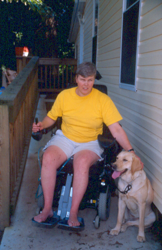 Man in wheelchair on a accessible ramp.